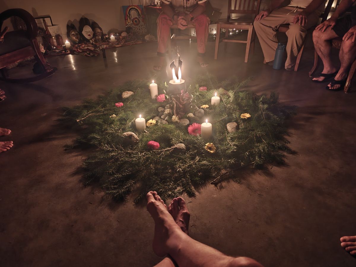 Candlelit circle in the temple at night