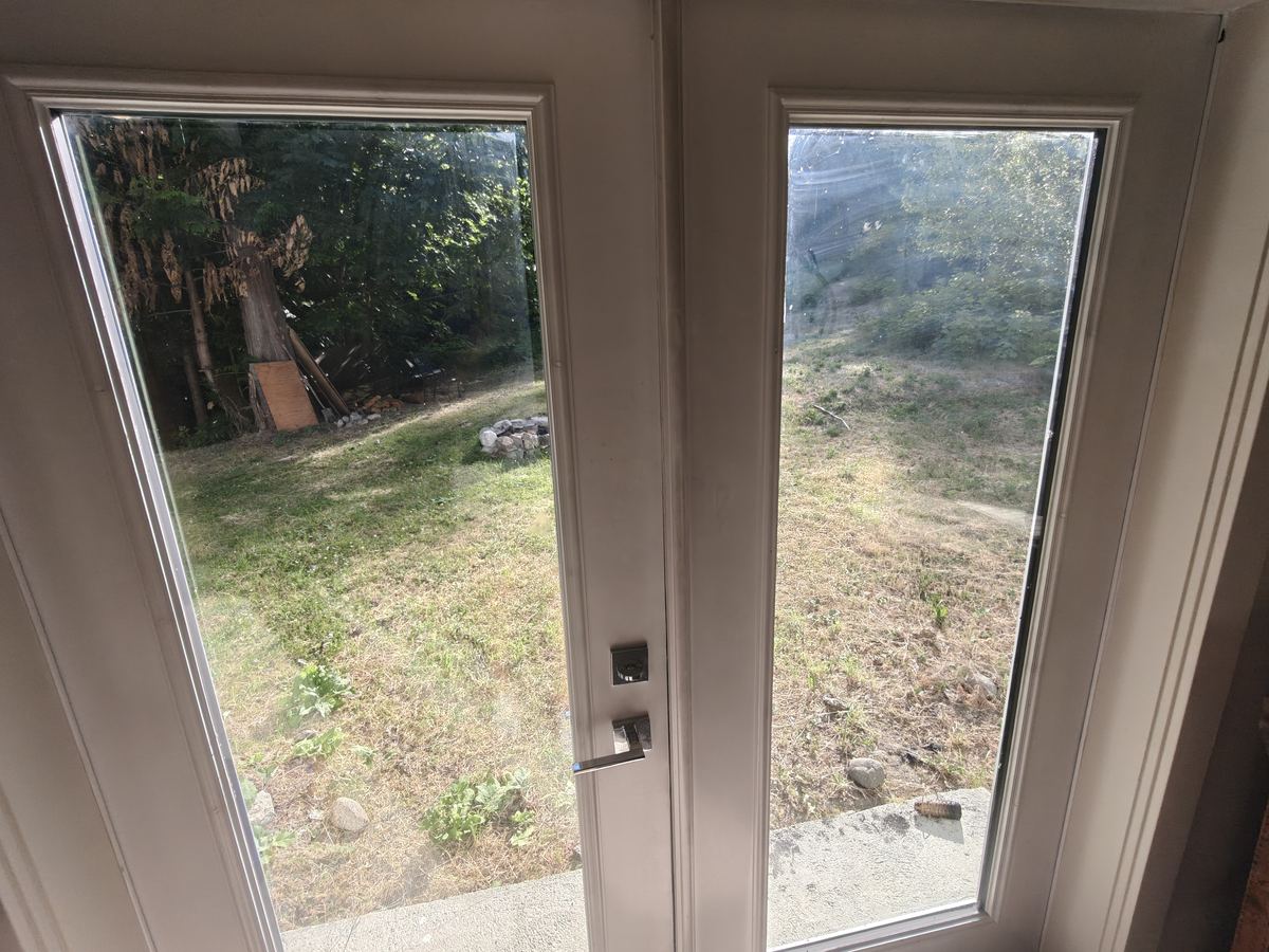 French doors from the temple out to the land